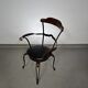 Italian postmodern turnable wrought iron dining chairs with leather seats