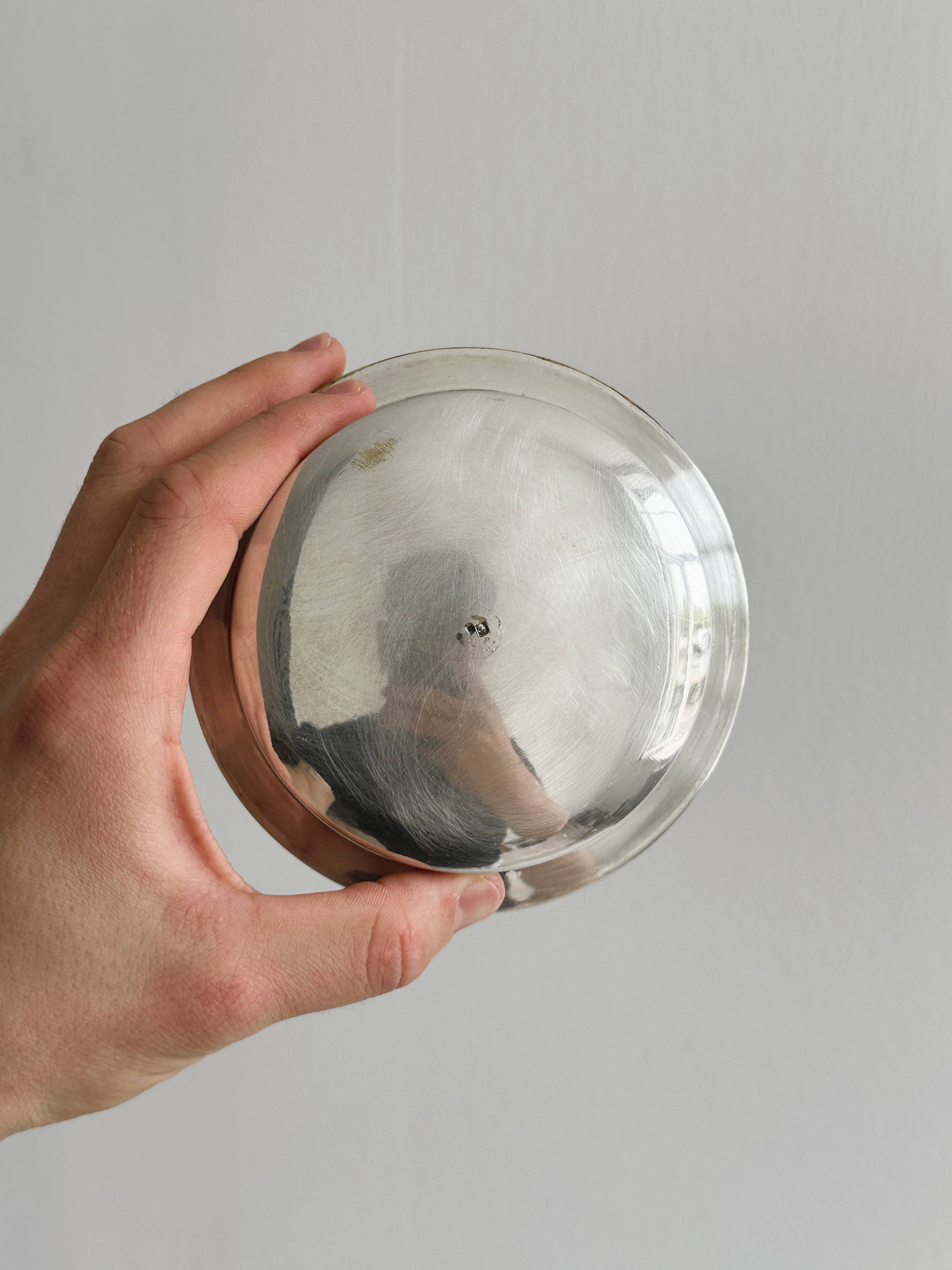 Antique butter dish in shiny metal