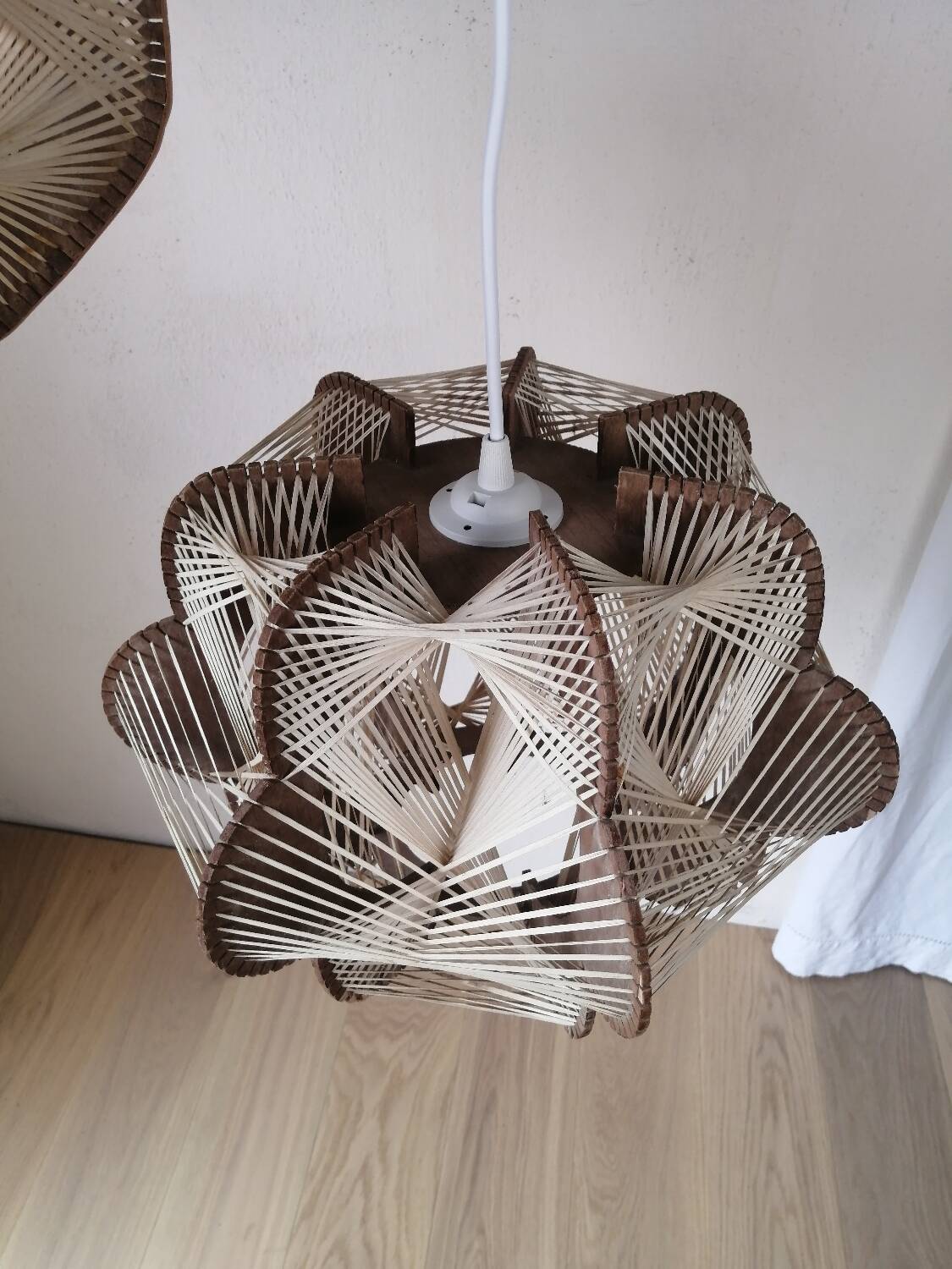 Pair of vintage wooden and rattan straw pendant lights.