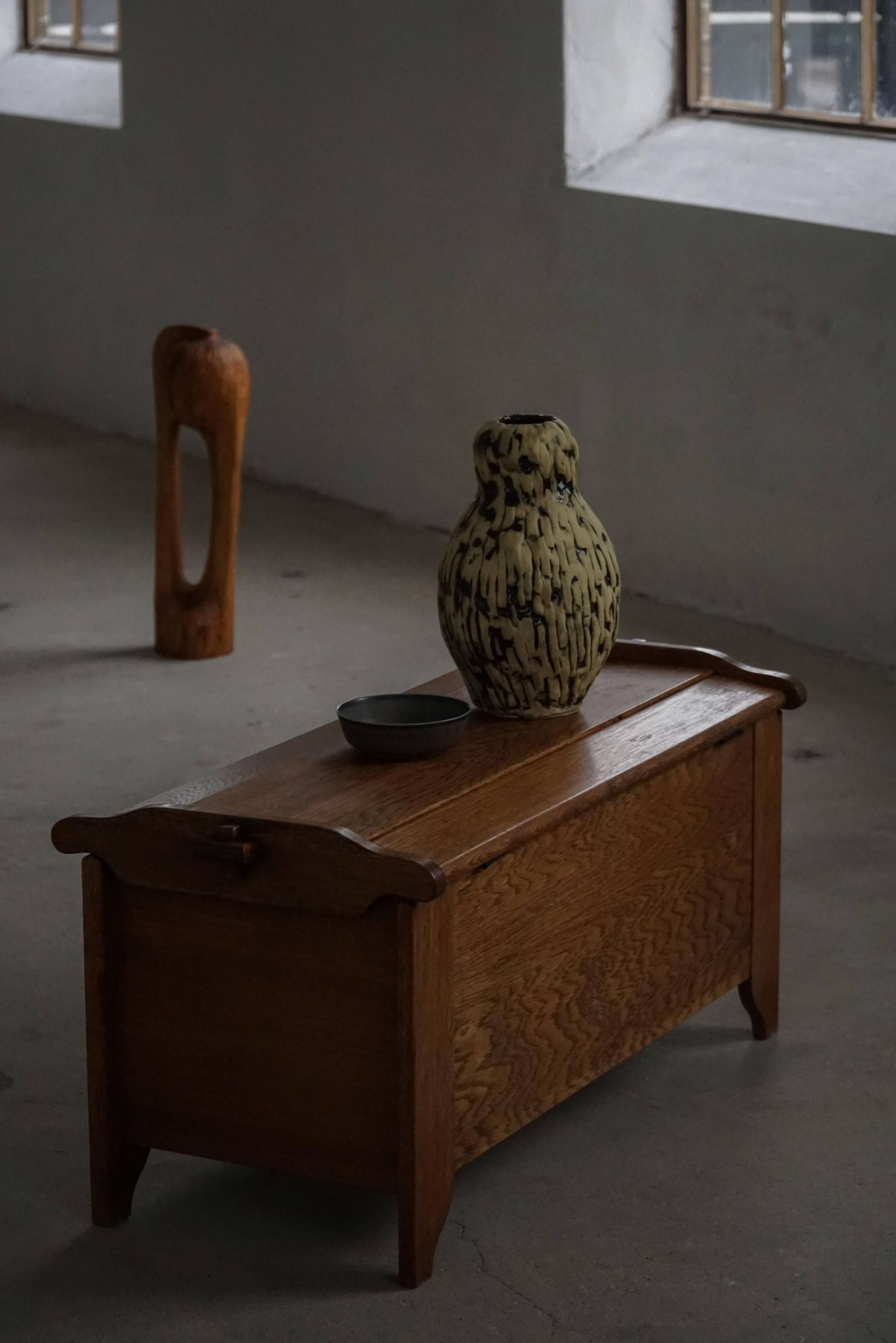 Modern Danish oak commode with decorative relief sculpture, mid-20th century.