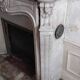 Louis XV style fireplace in veined white Carrara marble and XI ceramics.
