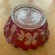 Red and transparent glass bowl with floral motifs and vintage wheat cobs