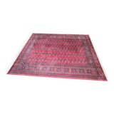 Large red Bokhara-style oriental carpet 300x200 cm with gul patterns.