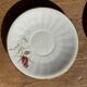Pair of white porcelain cups from ADP France with a floral pattern and their s