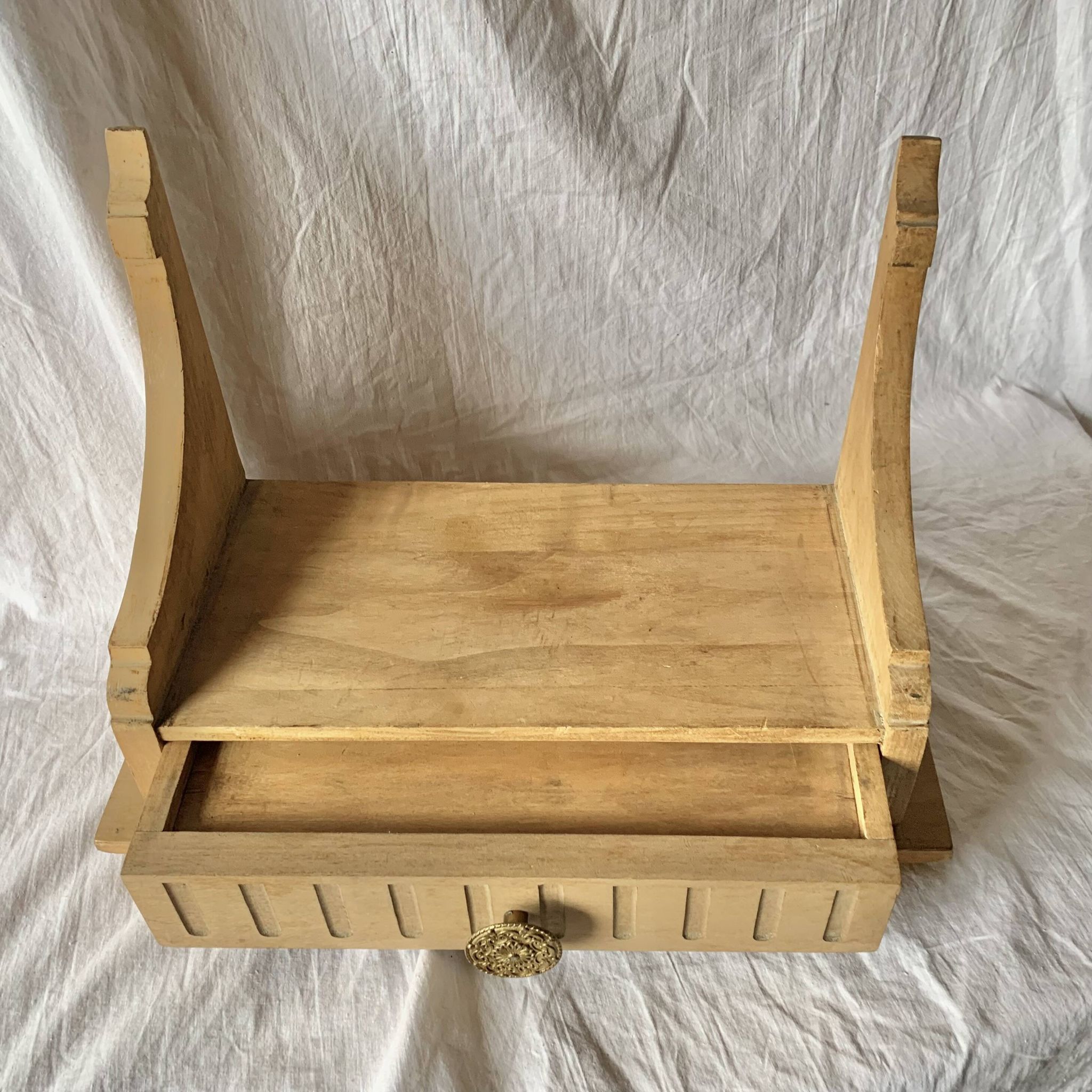 Old small hanging shelf in solid wood