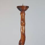 Vintage candle holder in an organic shape with a brass spike and tiered top.