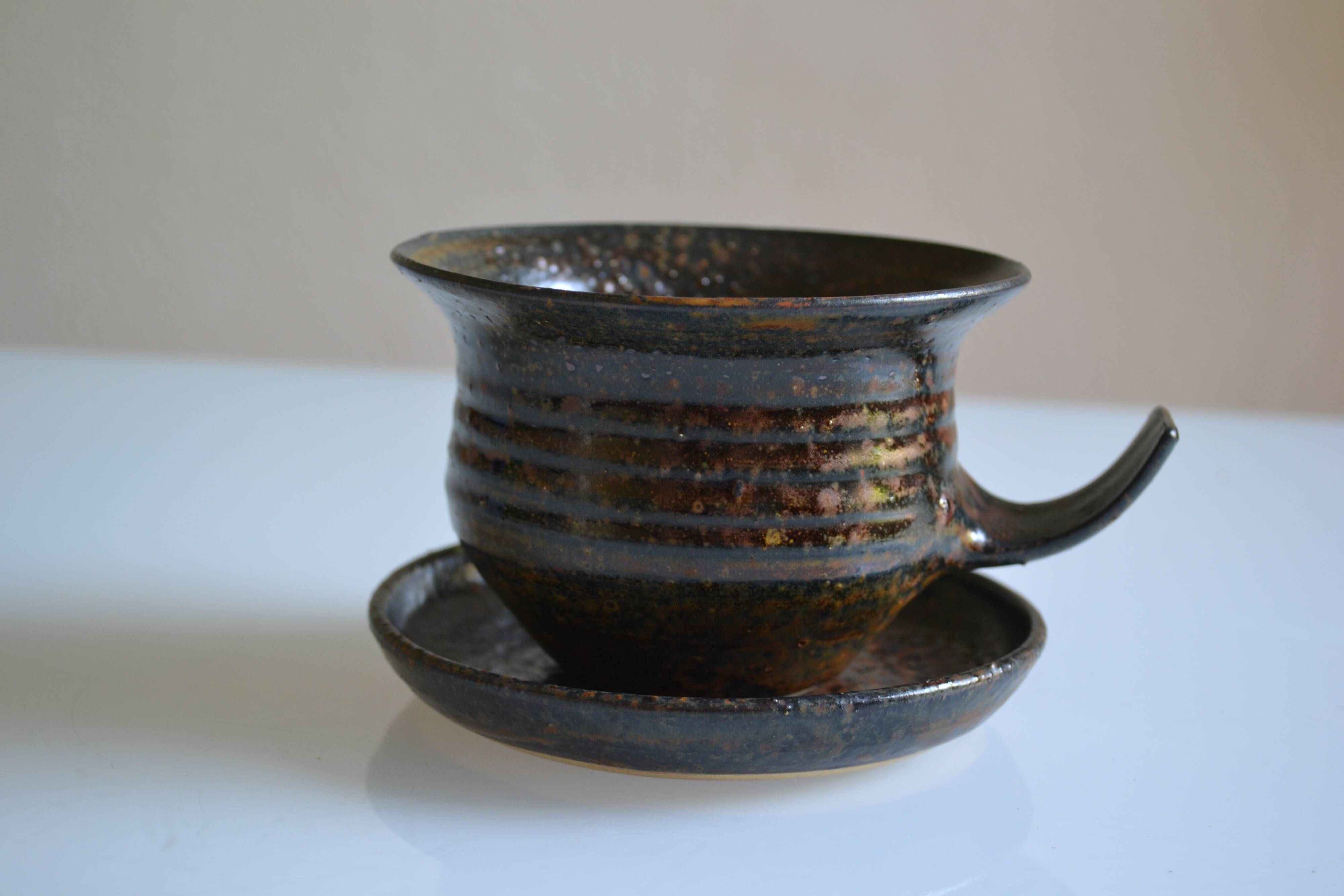 1970s ceramic cup and saucer signed