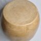 Brutalist monoxyle stool in solid mango wood with an organic shape.