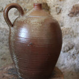 Vernified sandstone oil jar with handle