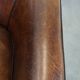 Sheep leather club chair finished with black piping