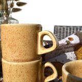 Series of 6 sandstone cups and saucers