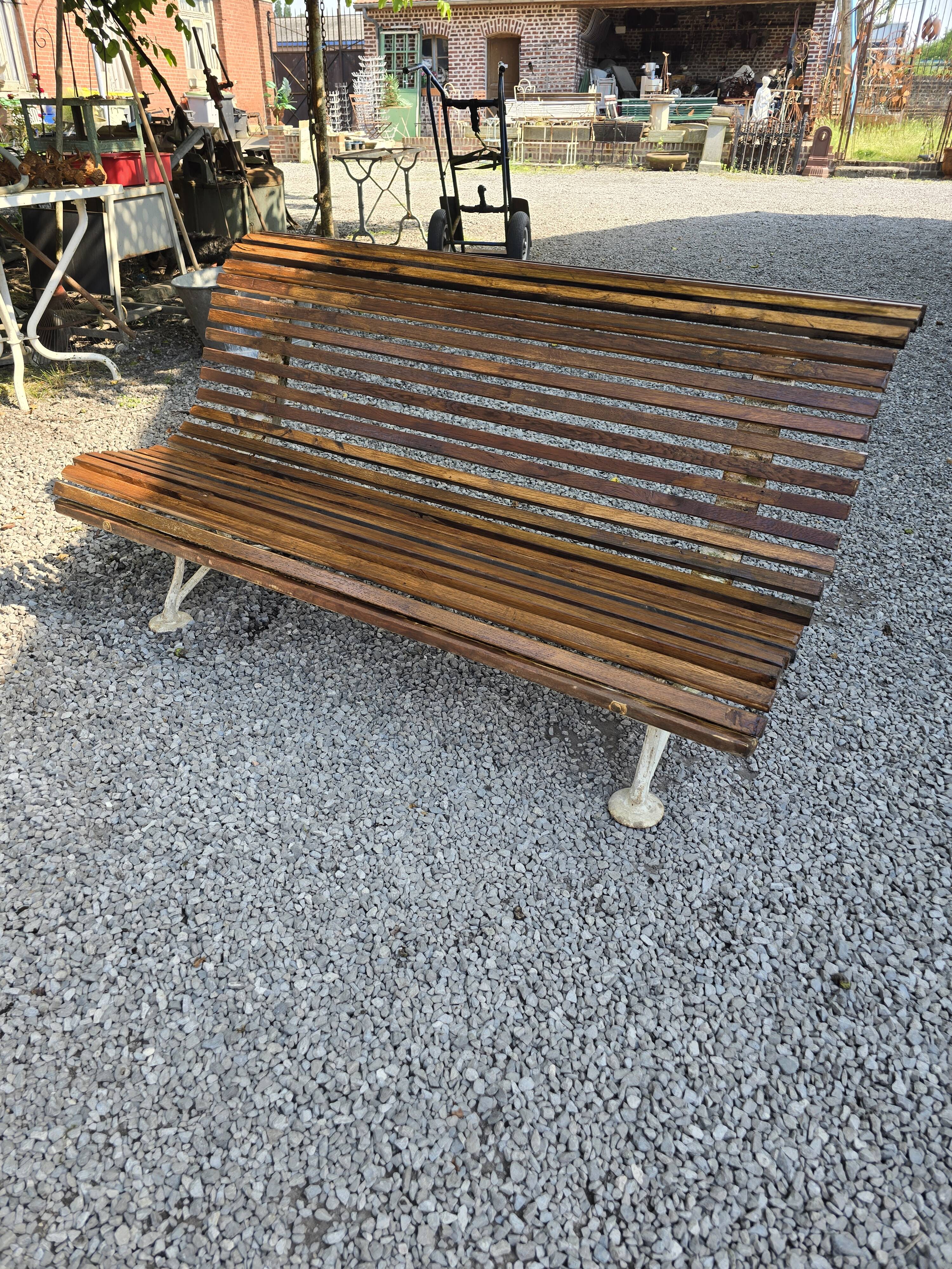 Garden bench with cast iron legs and oak slats
