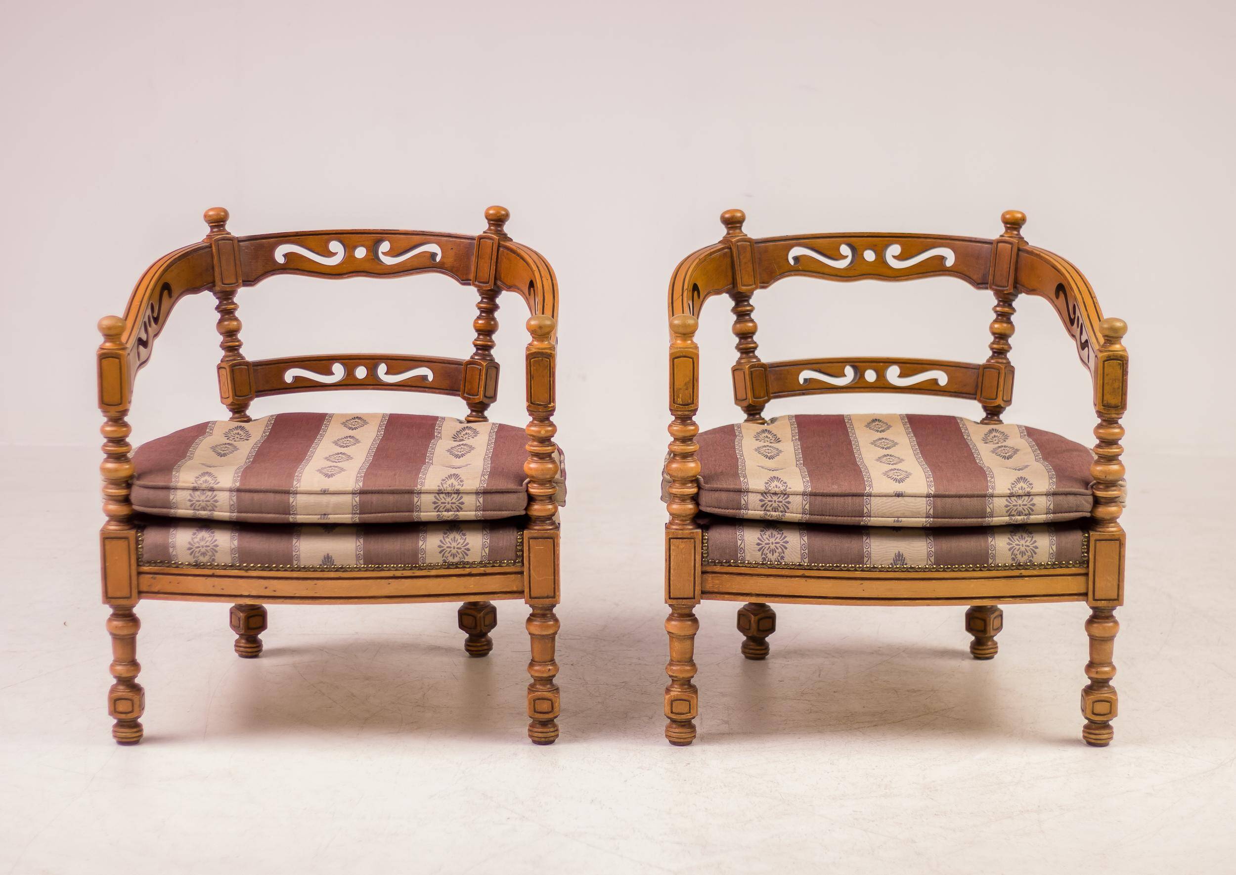 Pair of Giorgetti "1975 Gallery" armchairs in carved wood, original upholstery.