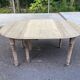 Round extendable dining table with flaps, stripped in raw oak, with 3 extensions.