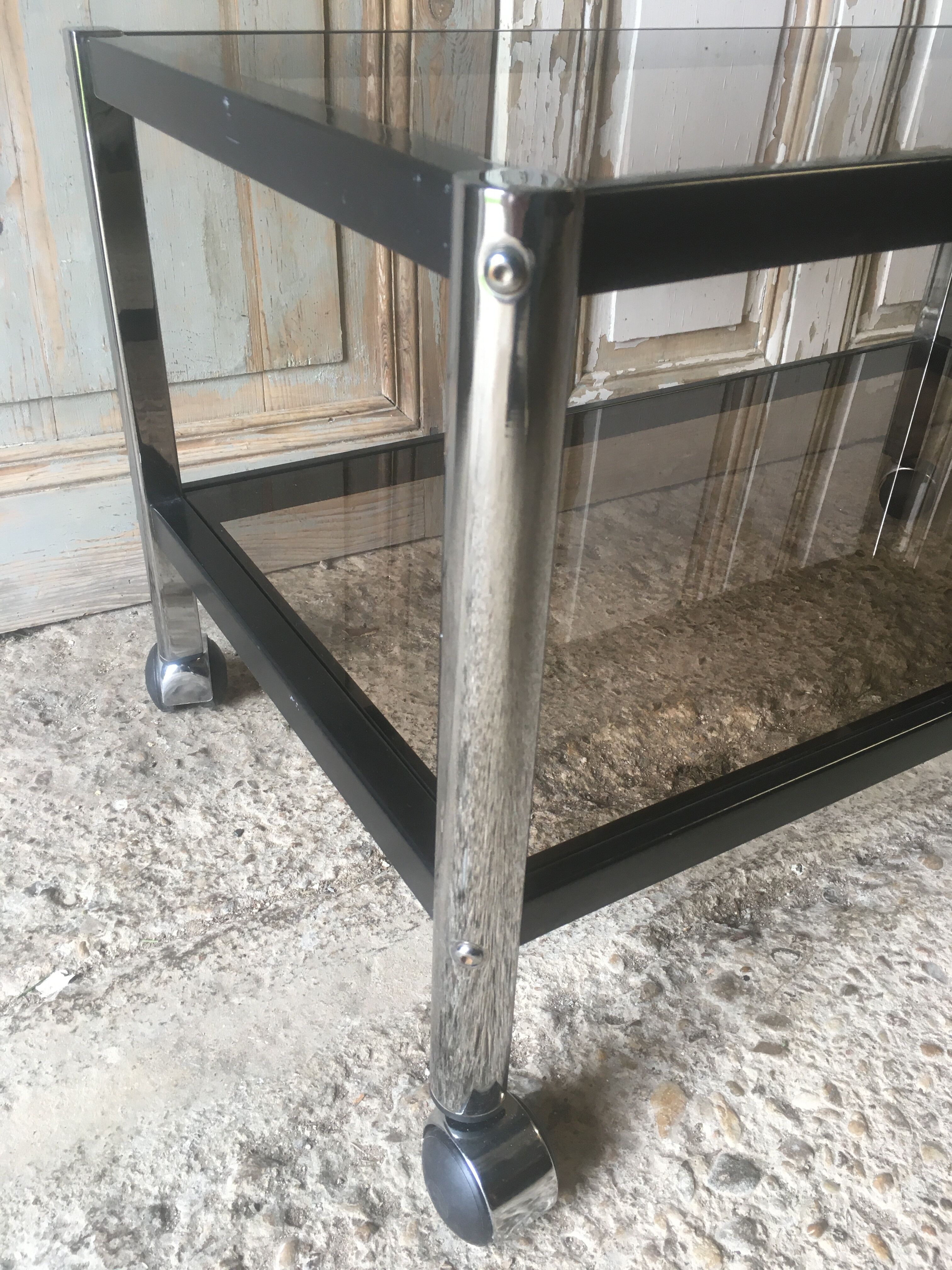 Metal coffee table with smoked glass.