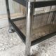 Metal coffee table with smoked glass.