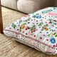 Cushion in hand-embroidered hemp.