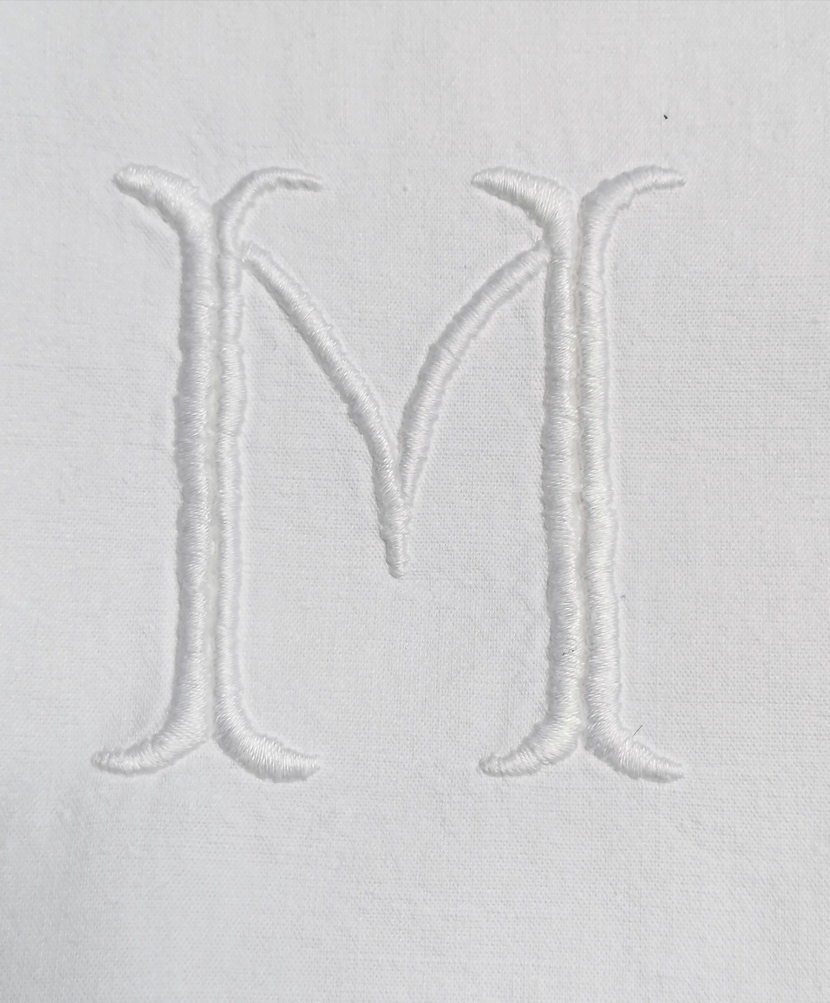 M and D monogram embroidered sheet