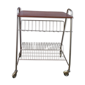 Serving table with gilded metal wheels and formica tray