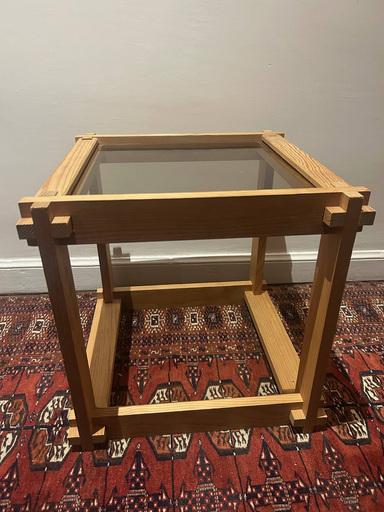 Brutalist table in wood and smoked glass