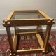 Table brutaliste en bois et verre fumé