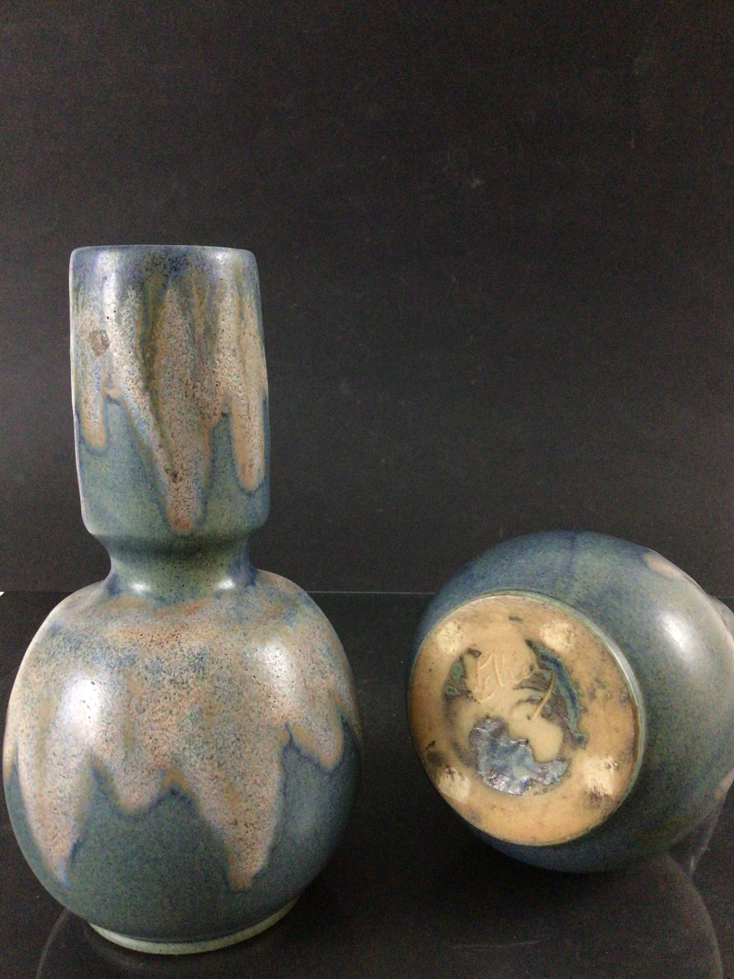 Pair of sandstone vases signed Lebret