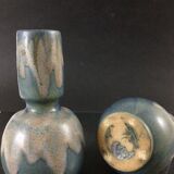 Pair of sandstone vases signed Lebret