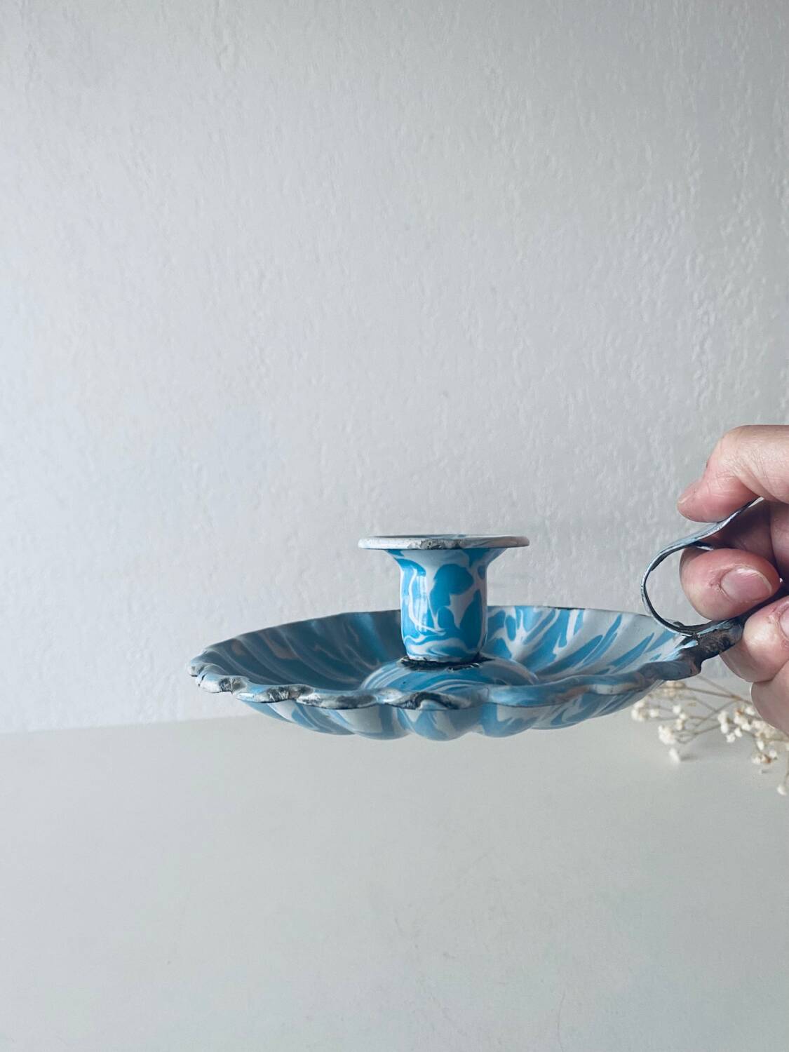 Old blue enameled metal candle holder