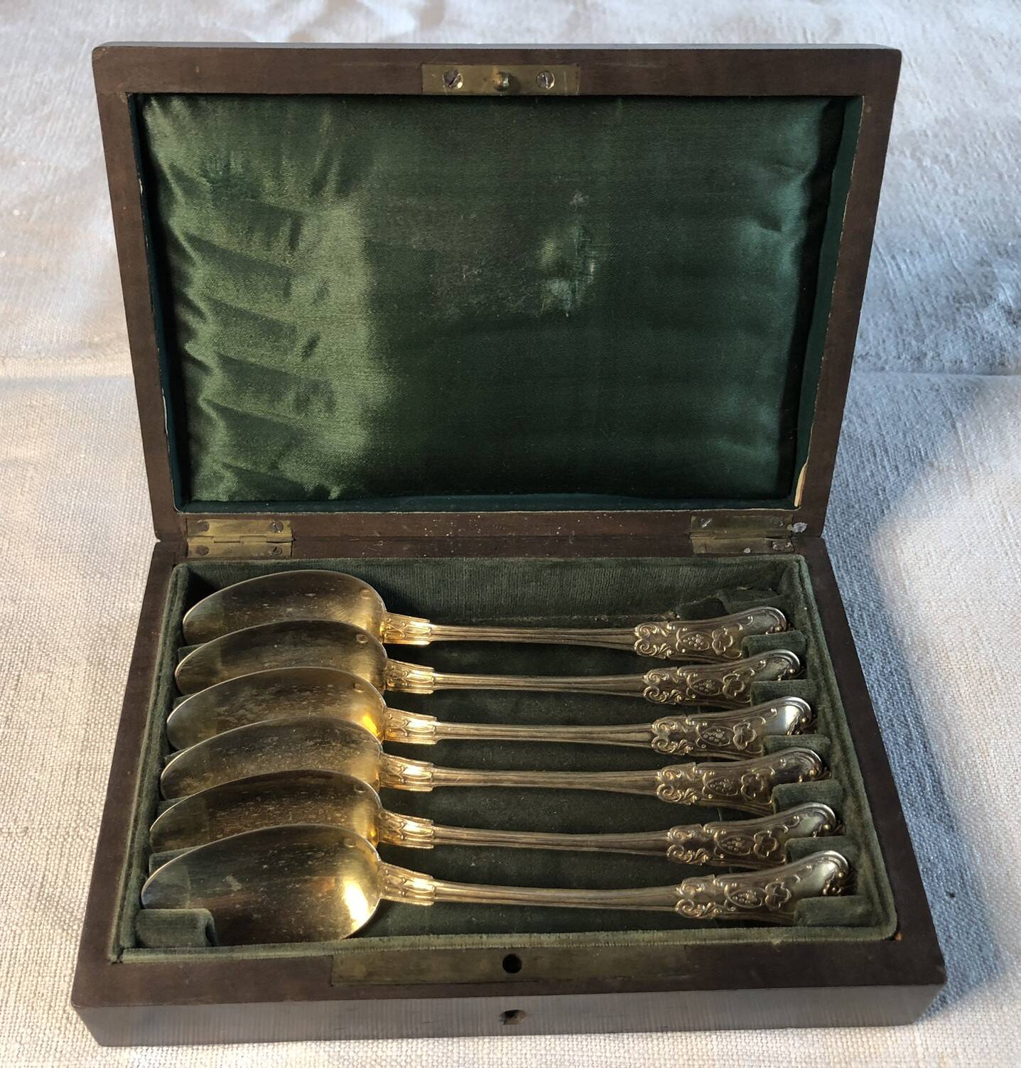 Vermeil (gilded silver) spoons in black wooden box