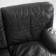 Black leather two-seater sofa. Roche Bobois edition. France, 1980s.