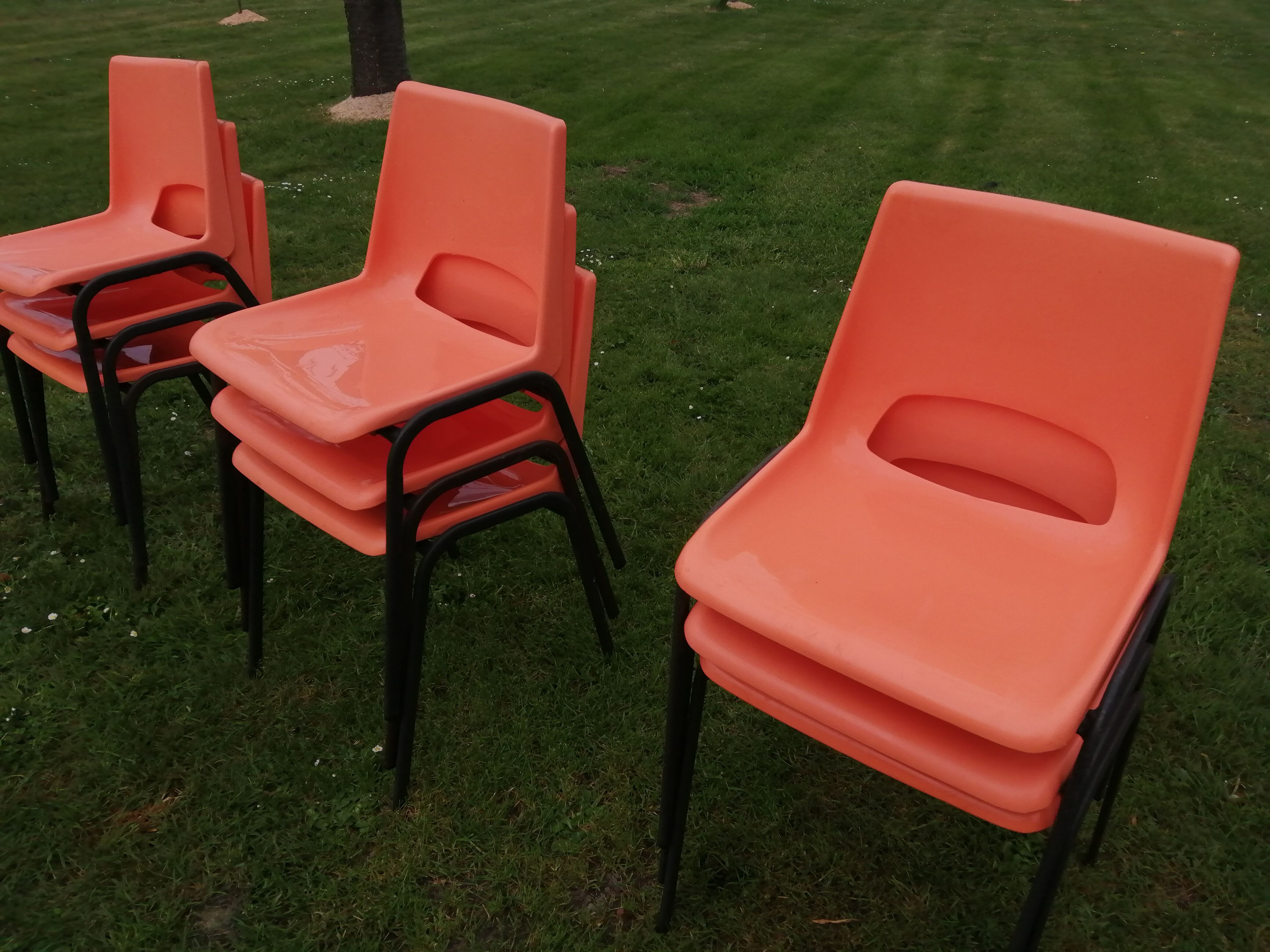 9 vintage orange plastic adult chairs