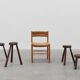 Brutalist French 1850s solid oak tripod stools with metal rim, set of 4