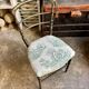 Napoleon III chair in blackened wood and green toile de Jouy.