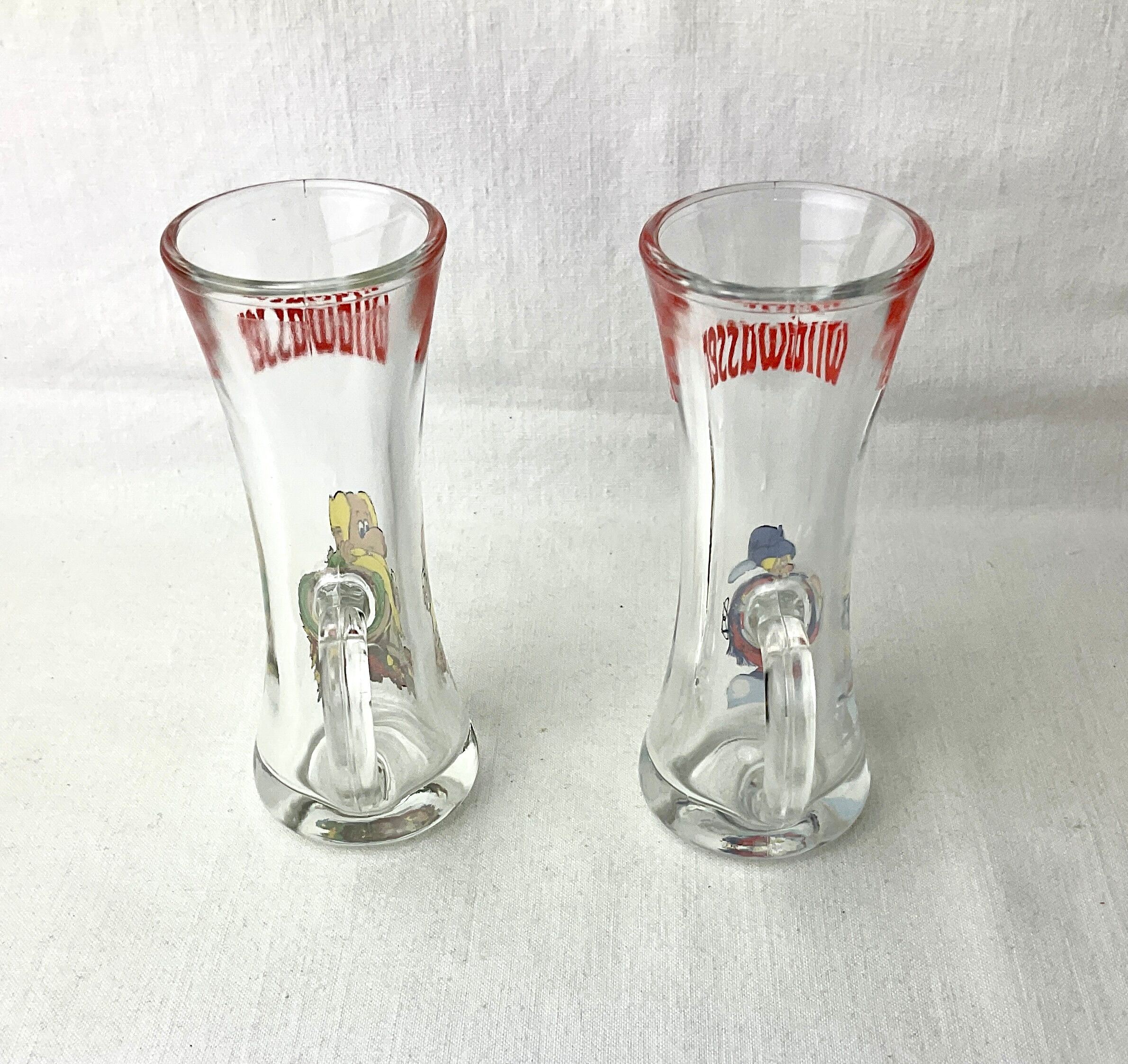 Pair of vintage illustrated spirits glasses Wildwasser