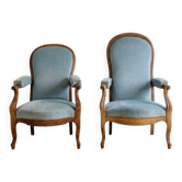 Pair of Louis XV reclining Voltaire armchairs in blue fabric.