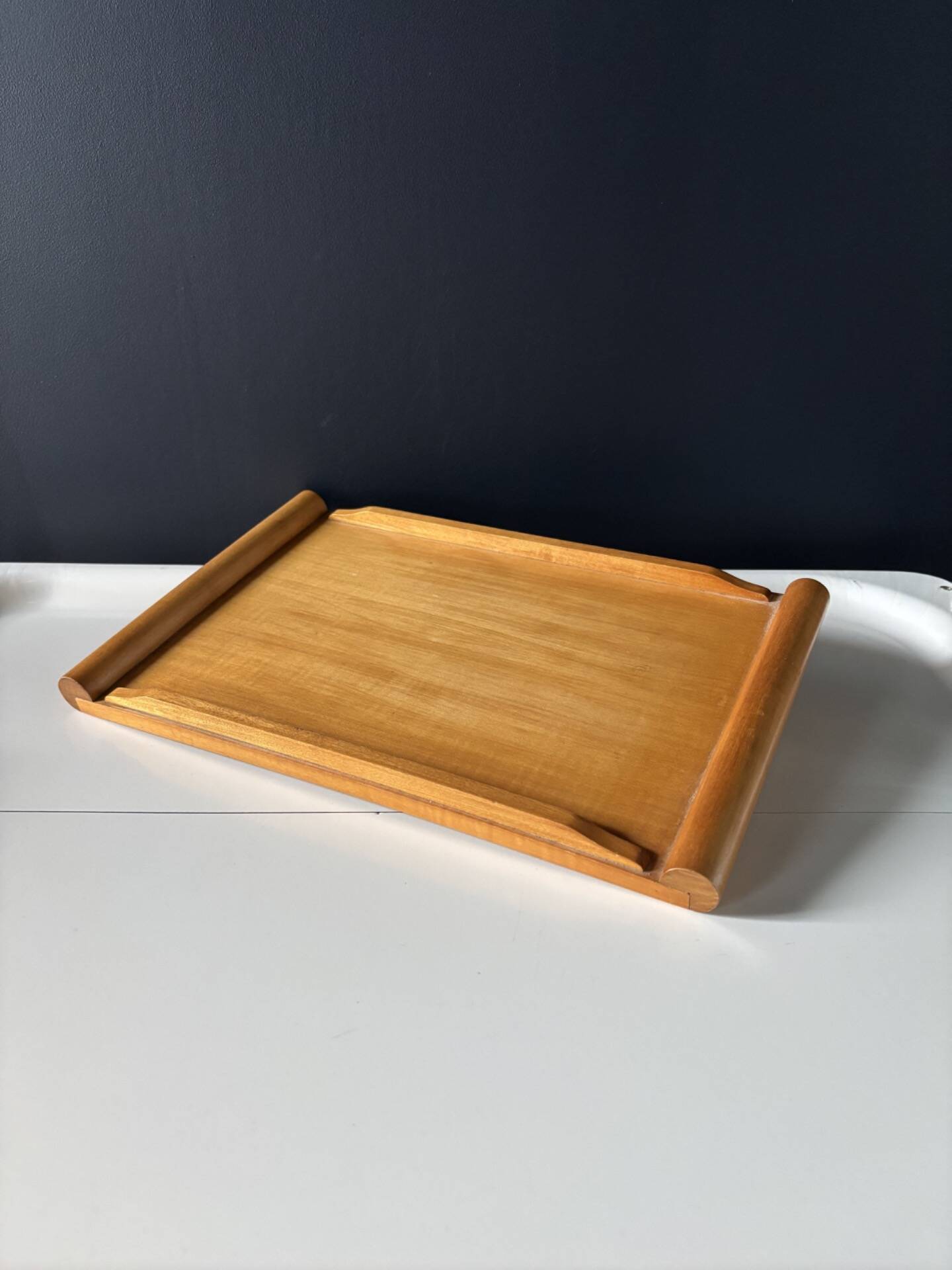 Vintage wooden plateau in Scandinavian style from the 60s — cylindrical handles.