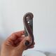 Old window handle with a forged iron cremon.