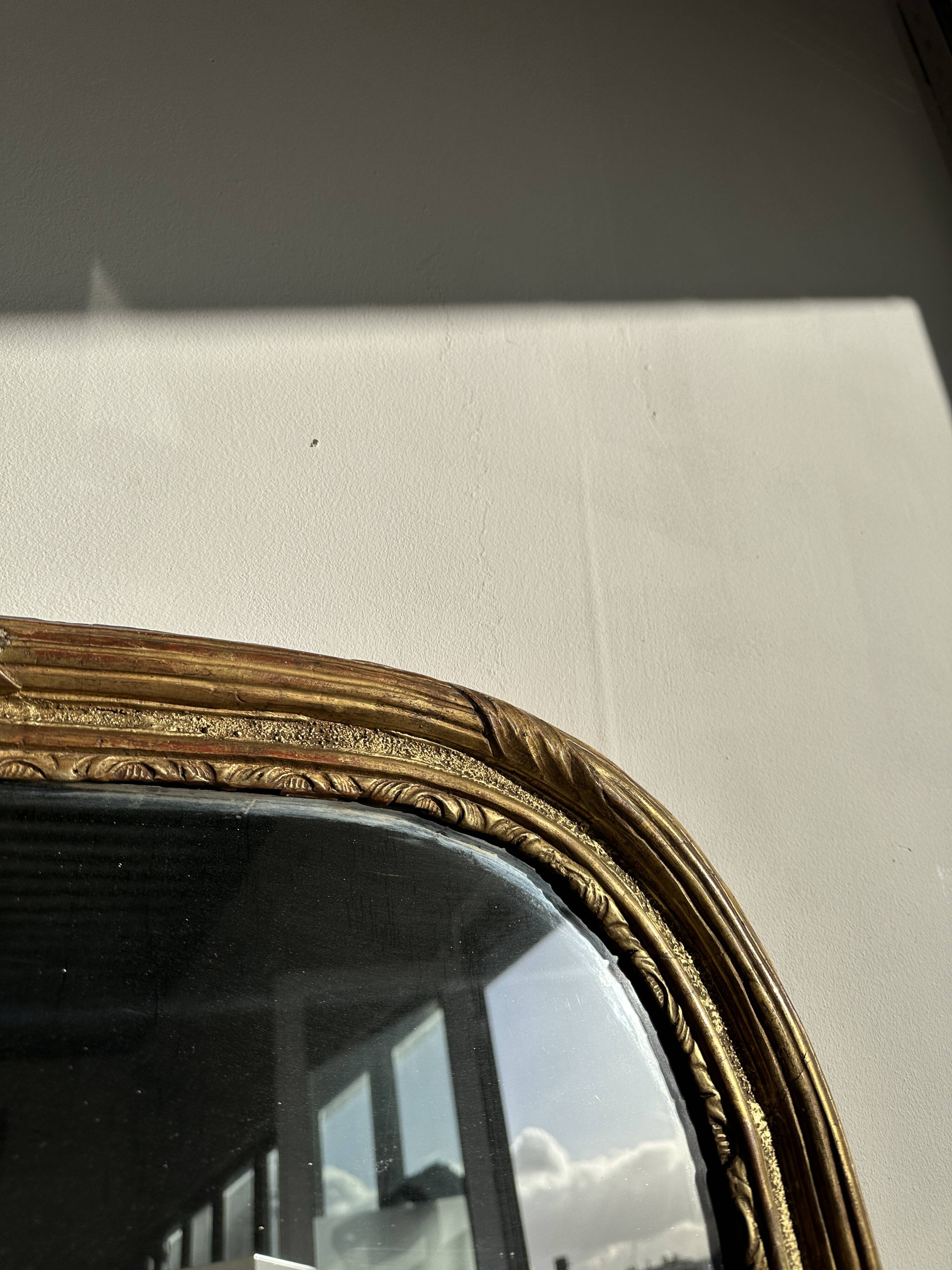 Large gilded mirror 19th century rounded corners mercury glass Louis XVI style