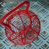 Egg basket in wire painted red, vintage from the 1970s