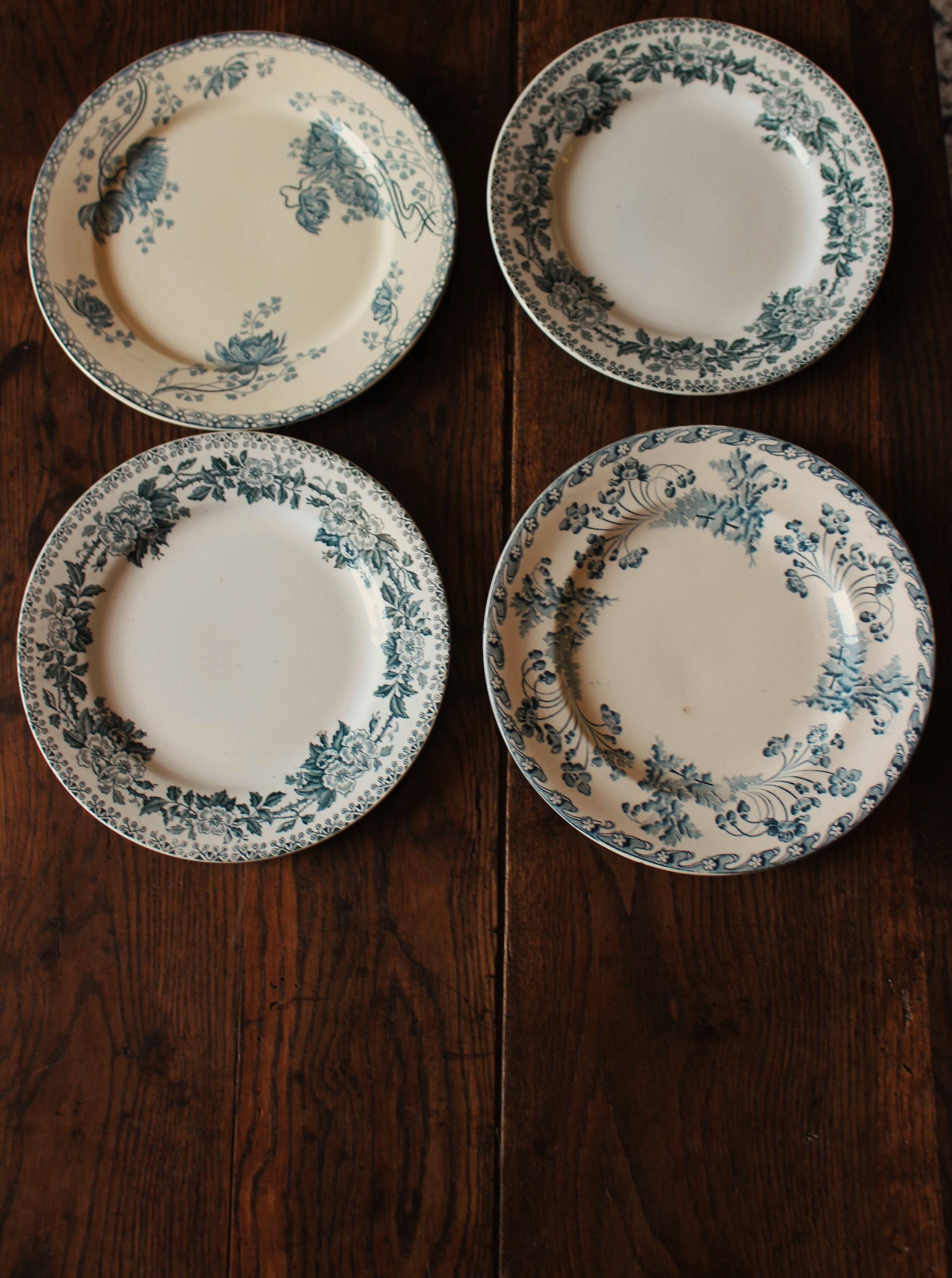 Set of 4 mismatched blue flat plates