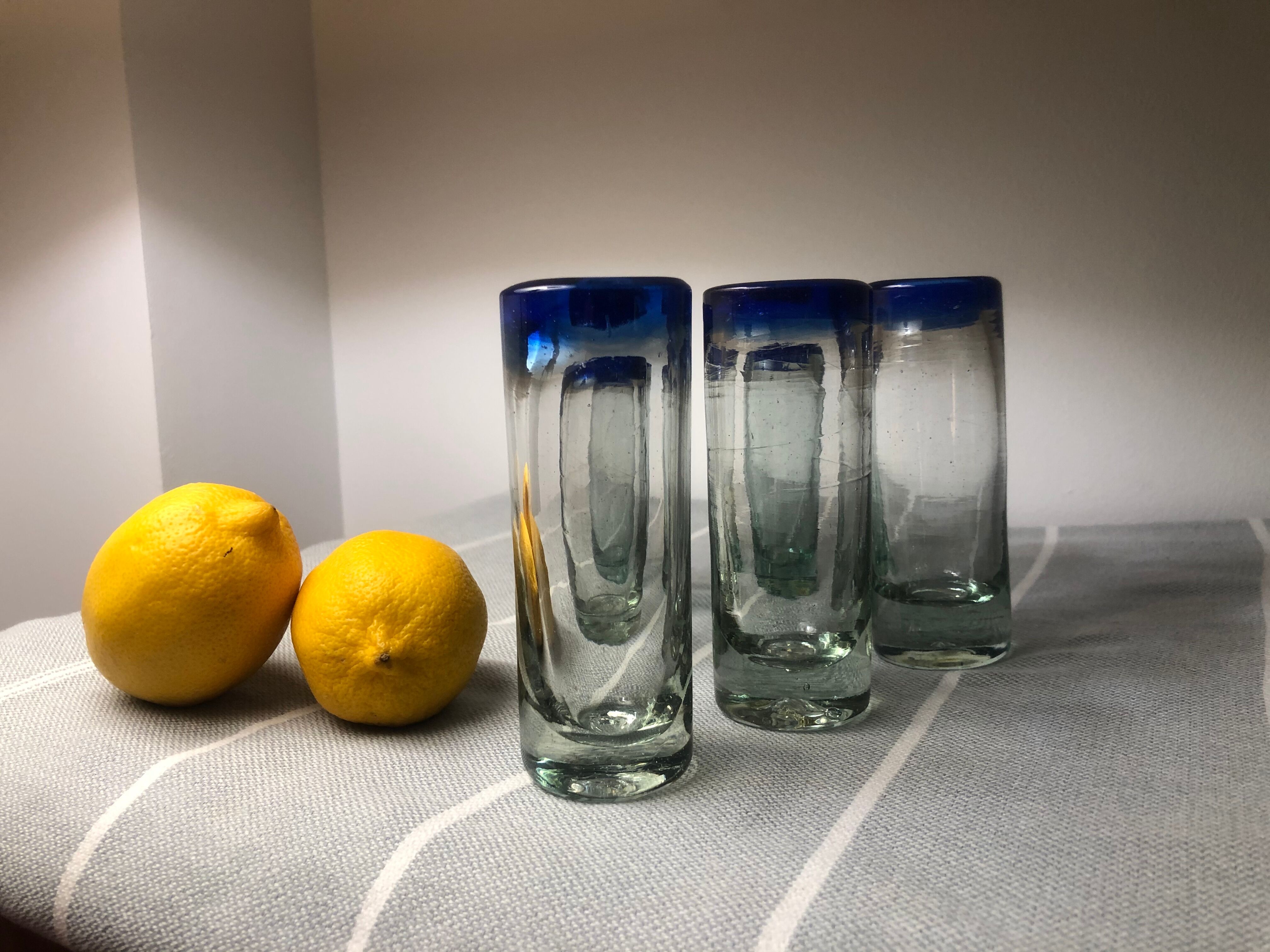 Handmade cobalt blue tequila glasses made of recycled glass