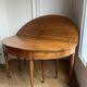 Large oval table from the early 19th century in walnut, 3.17m with extensions.