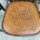 4 bentwood bistro chairs with a pattern on the seat