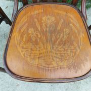 4 bentwood bistro chairs with a pattern on the seat