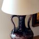 Vintage ceramic lamp with striped cotton shade.