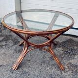 Round rattan and wicker table with glass top