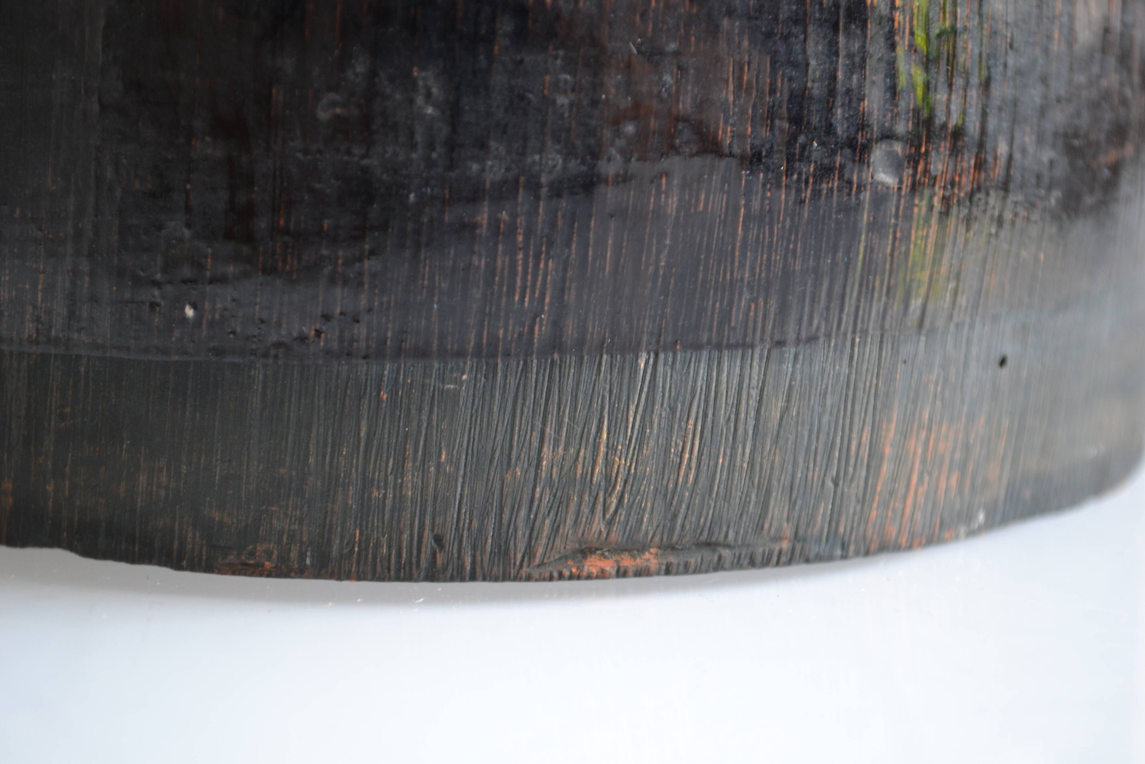 Ceramic vase with a signature fish to identify.