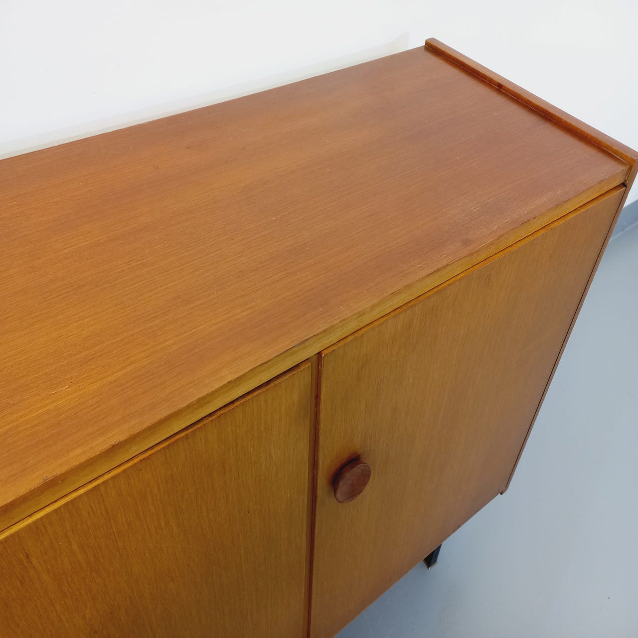 Vintage teak and black metal row from the 60s