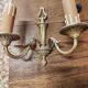 Two antique wall sconces in gilded bronze in the Louis XVI style.