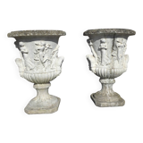 Medical vases with characters in reconstituted stone.